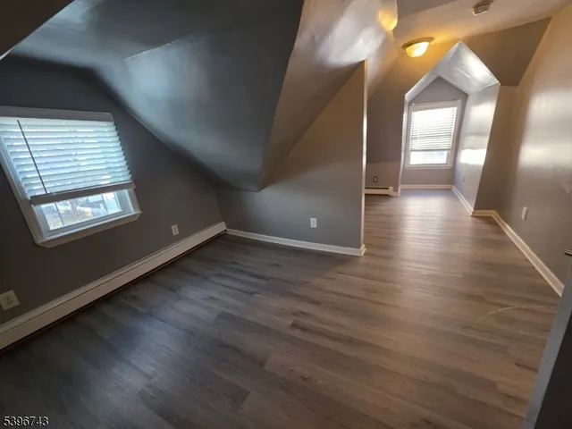 a view of gallery with wooden floor