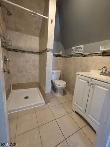 a bathroom with a shower and a toilet
