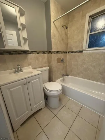 a bathroom with a toilet a sink and bathtub