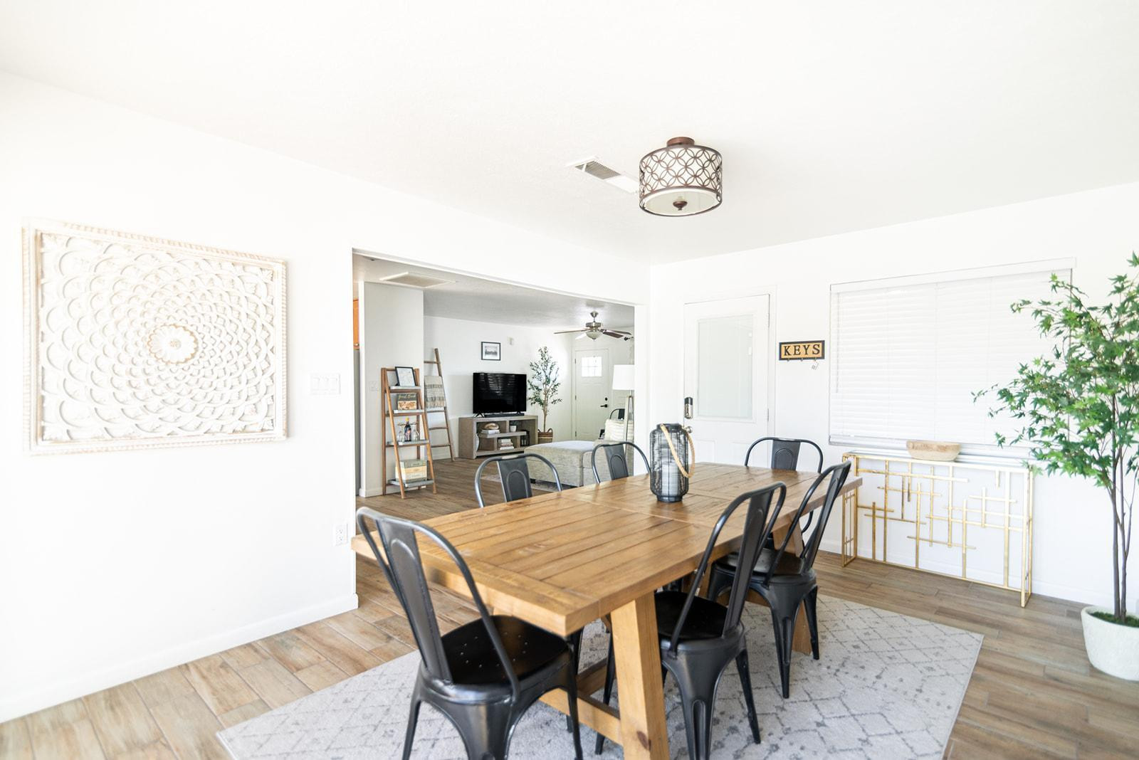 7435 East Granada Road Scottsdale, AZ 85257 - Photo 11 of 28 a view of a dining room with furniture and wooden floor