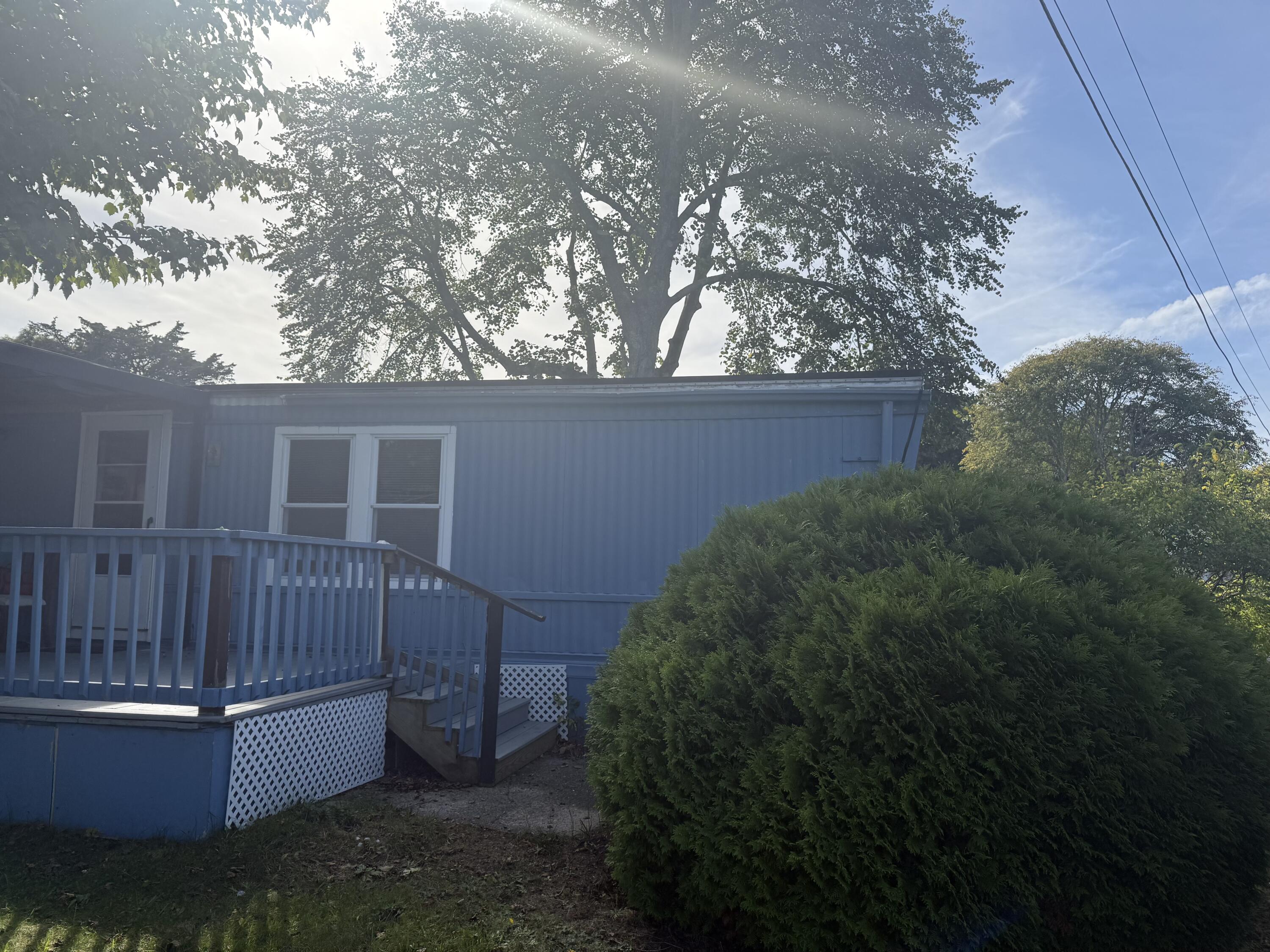 7 4th Avenue Pocasset, MA 02559 - Photo 3 of 9 a view of backyard with tub and trees