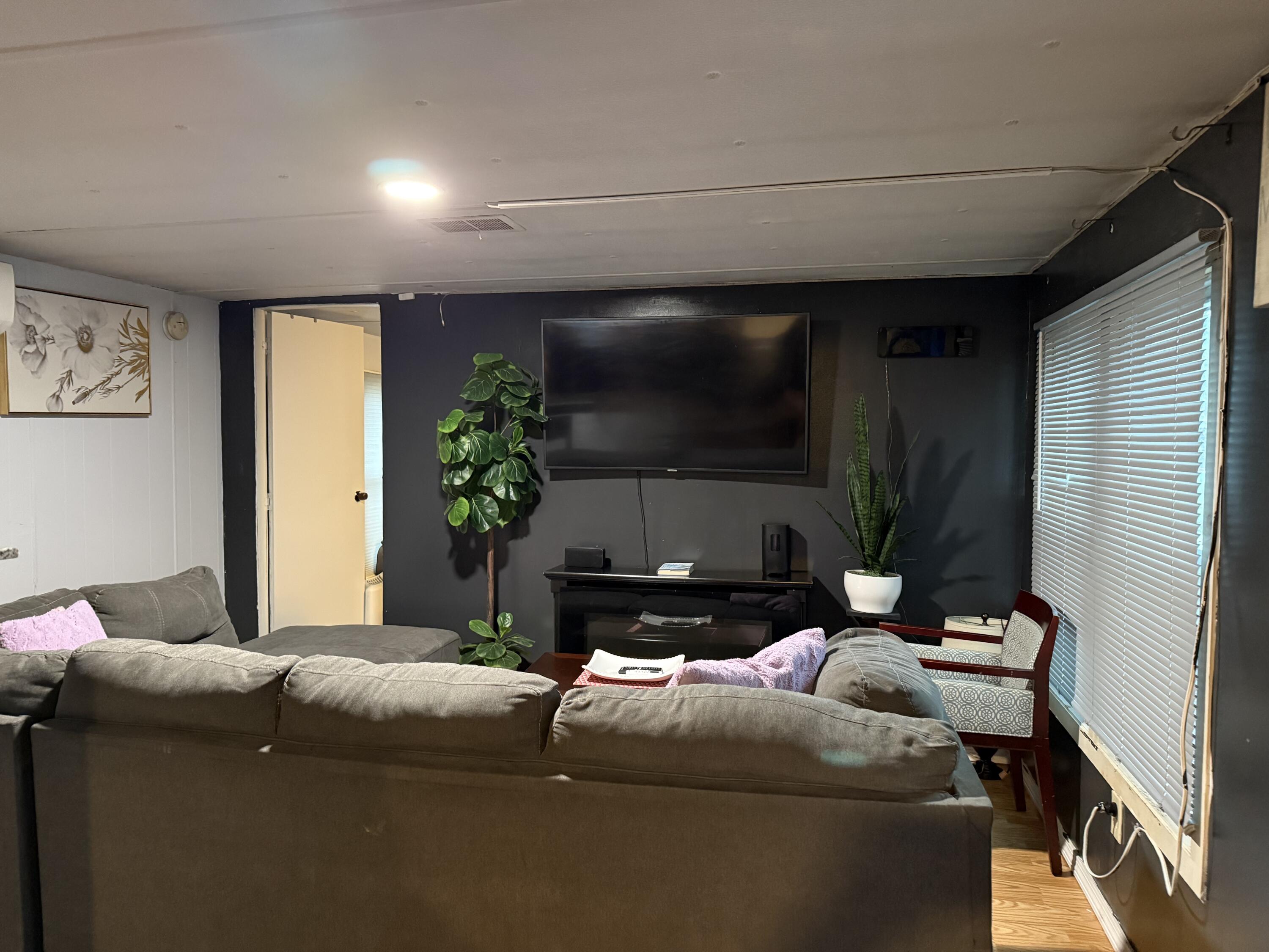 7 4th Avenue Pocasset, MA 02559 - Photo 5 of 9 a living room with furniture and a flat screen tv