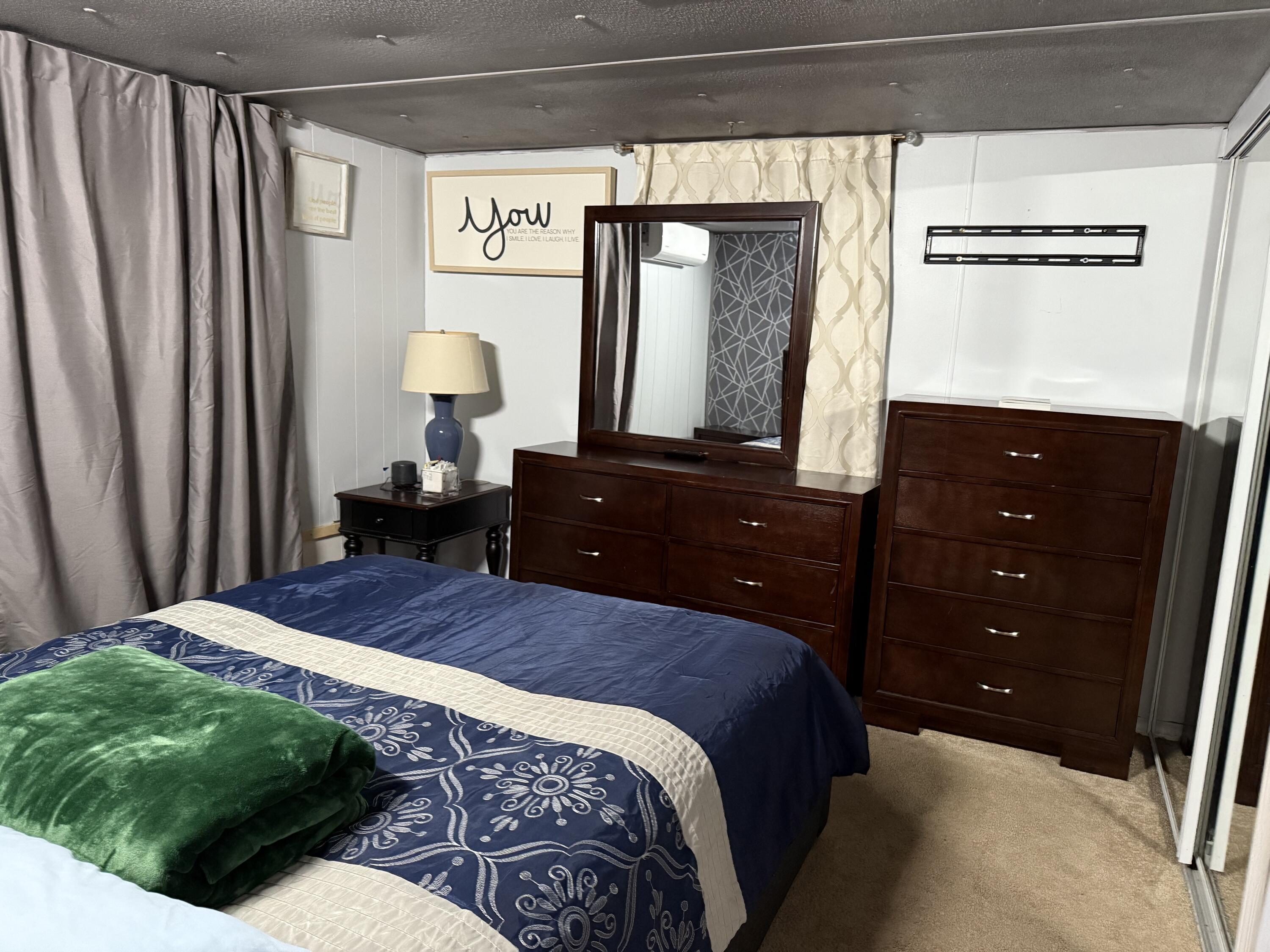 7 4th Avenue Pocasset, MA 02559 - Photo 7 of 9 a bedroom with a bed and a mirror on dresser