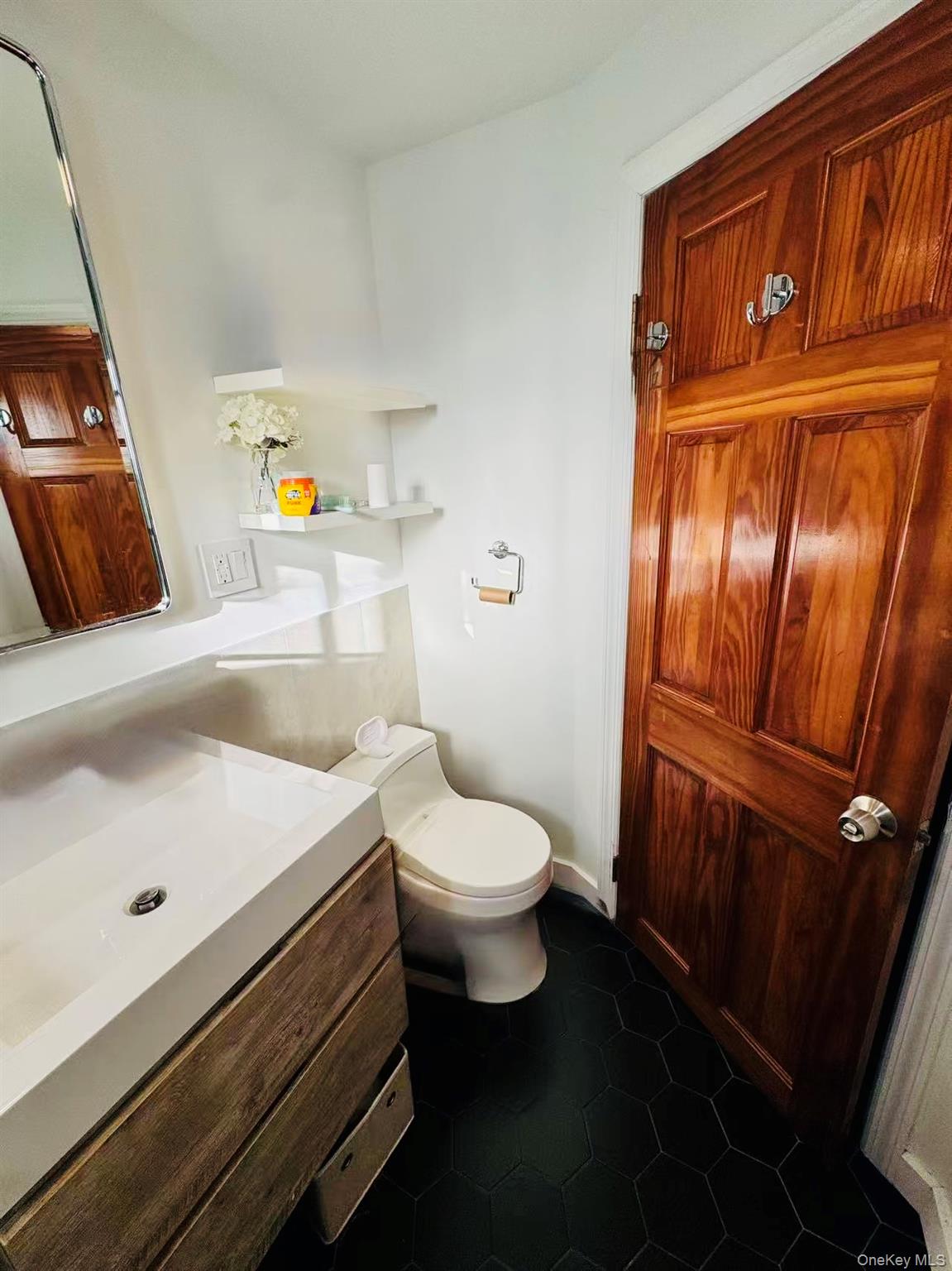 89-36 90th Street Queens, NY 11421 - Photo 13 of 17 a bathroom with a sink a toilet and shower