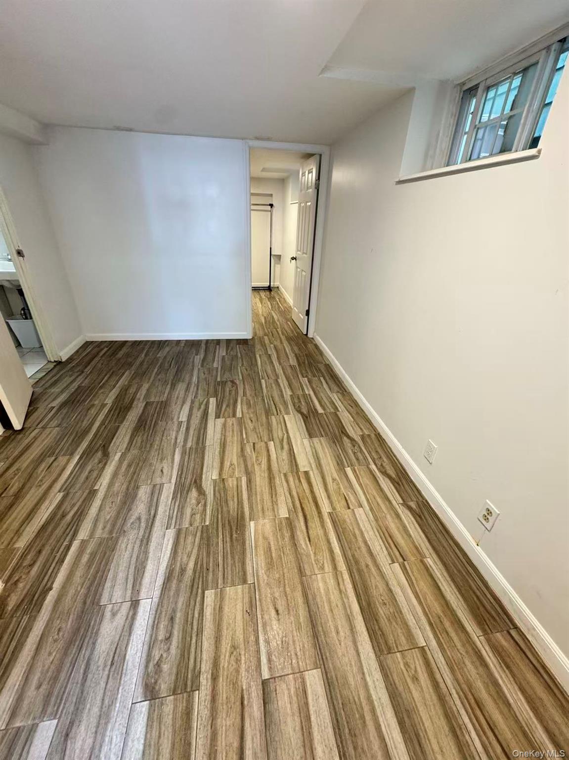 89-36 90th Street Queens, NY 11421 - Photo 15 of 17 a view of wooden floor
