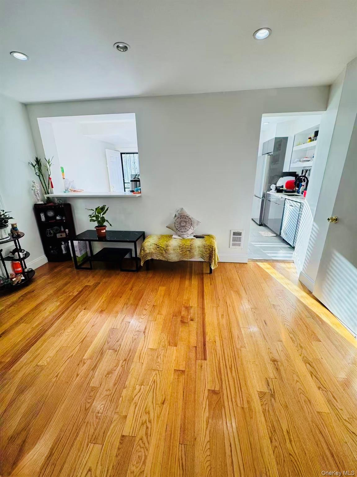 89-36 90th Street Queens, NY 11421 - Photo 8 of 17 a bedroom with a bed and a dresser