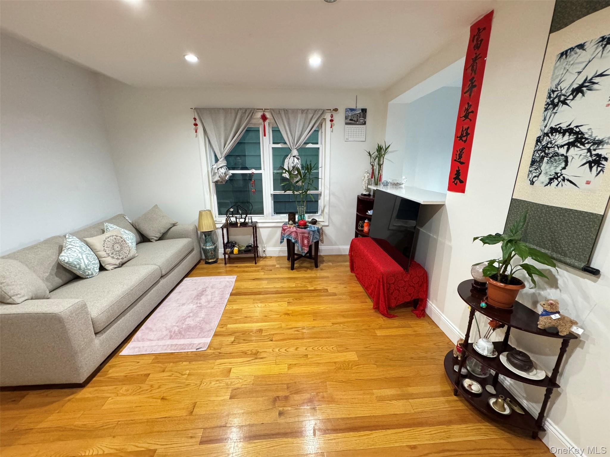 89-36 90th Street Queens, NY 11421 - Photo 9 of 17 a living room with furniture fireplace and flat screen tv