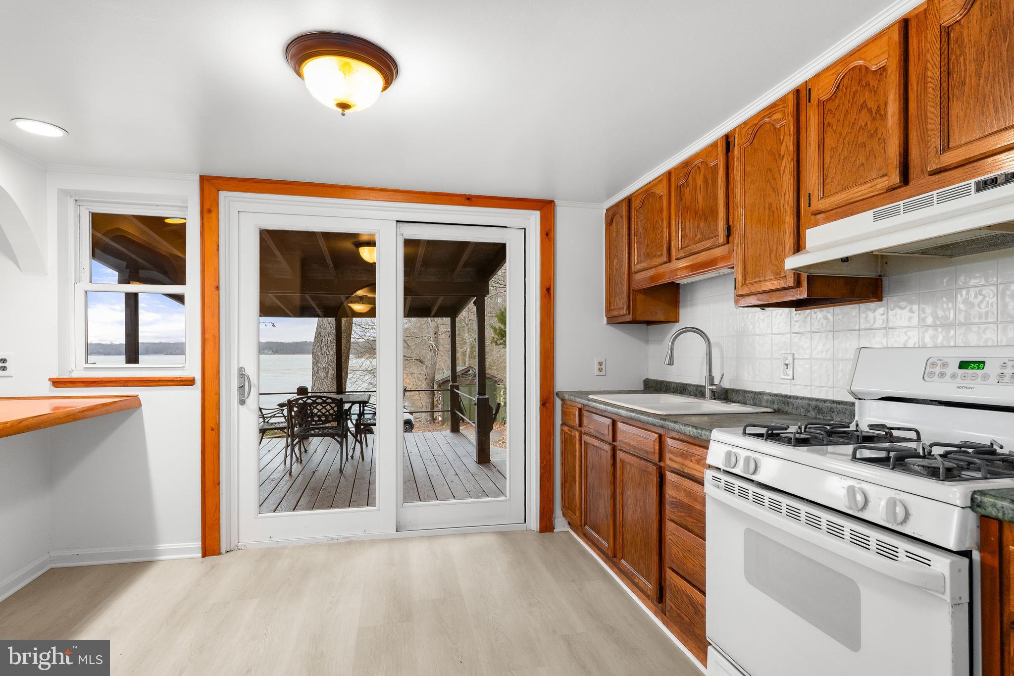 37 Cattail Lane Elkton, MD 21921 - Photo 22 of 42 a kitchen with a stove a sink and a microwave