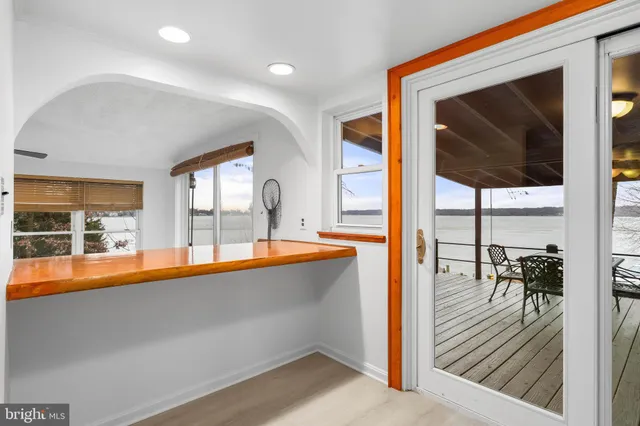 a kitchen with stainless steel appliances granite countertop a sink a stove and cabinets