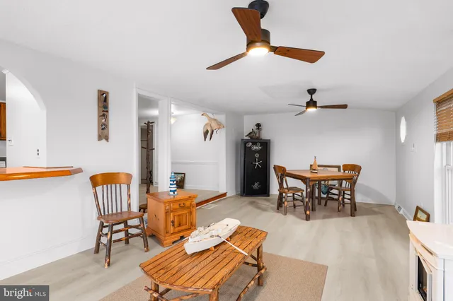 a view of a livingroom with furniture and a window