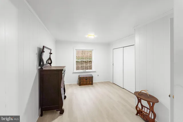 a bedroom with a bed and furniture