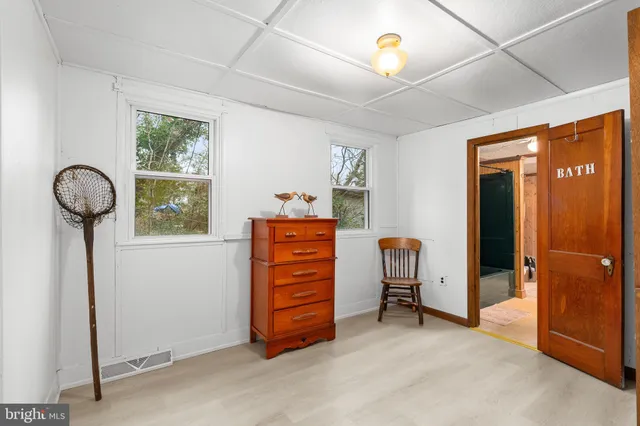 a view of an entryway with wooden floor