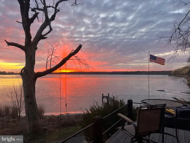 a view of a terrace with chairs and a table