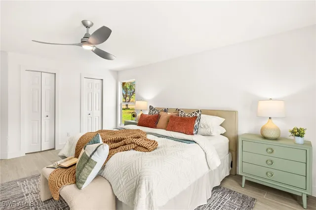 a bedroom with a bed and window