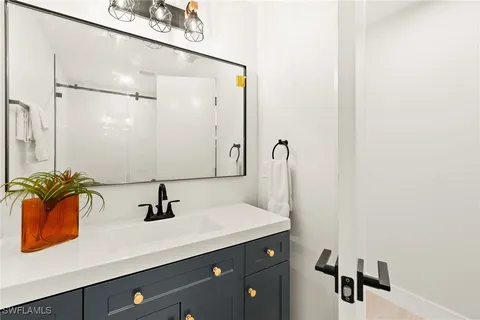 a bathroom with a sink and mirror