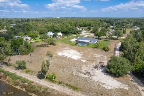 an aerial view of a houses with a yard