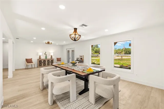 a dining room with furniture and window