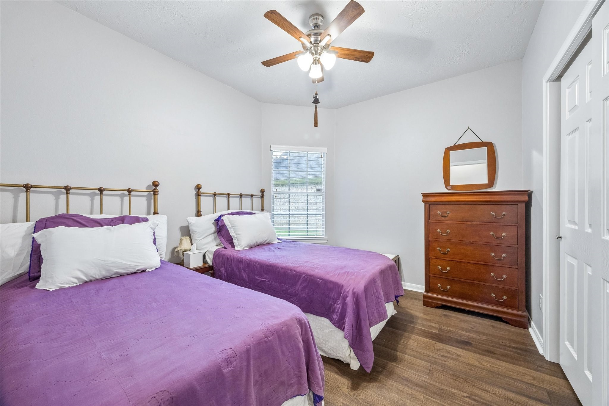 12423 Rutgers Park Court Houston, TX 77058 - Photo 26 of 29 a bedroom with two beds and a closet