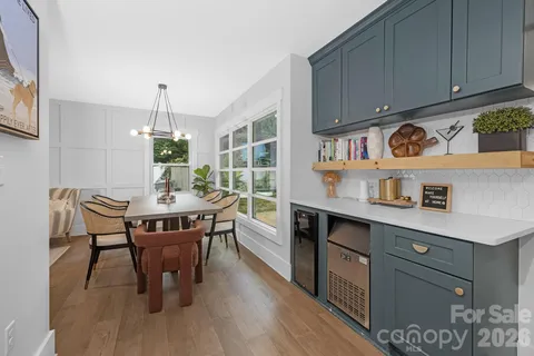 a kitchen with stainless steel appliances granite countertop a sink dishwasher and cabinets with wooden floor