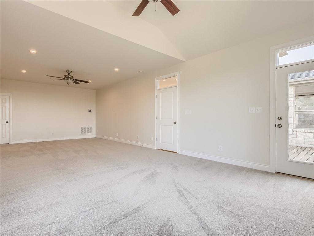 267 North Commons Ford Road Austin, TX 78733 - Photo 15 of 34 Spare room with ceiling fan, light colored carpet, recessed lighting, and vaulted ceiling