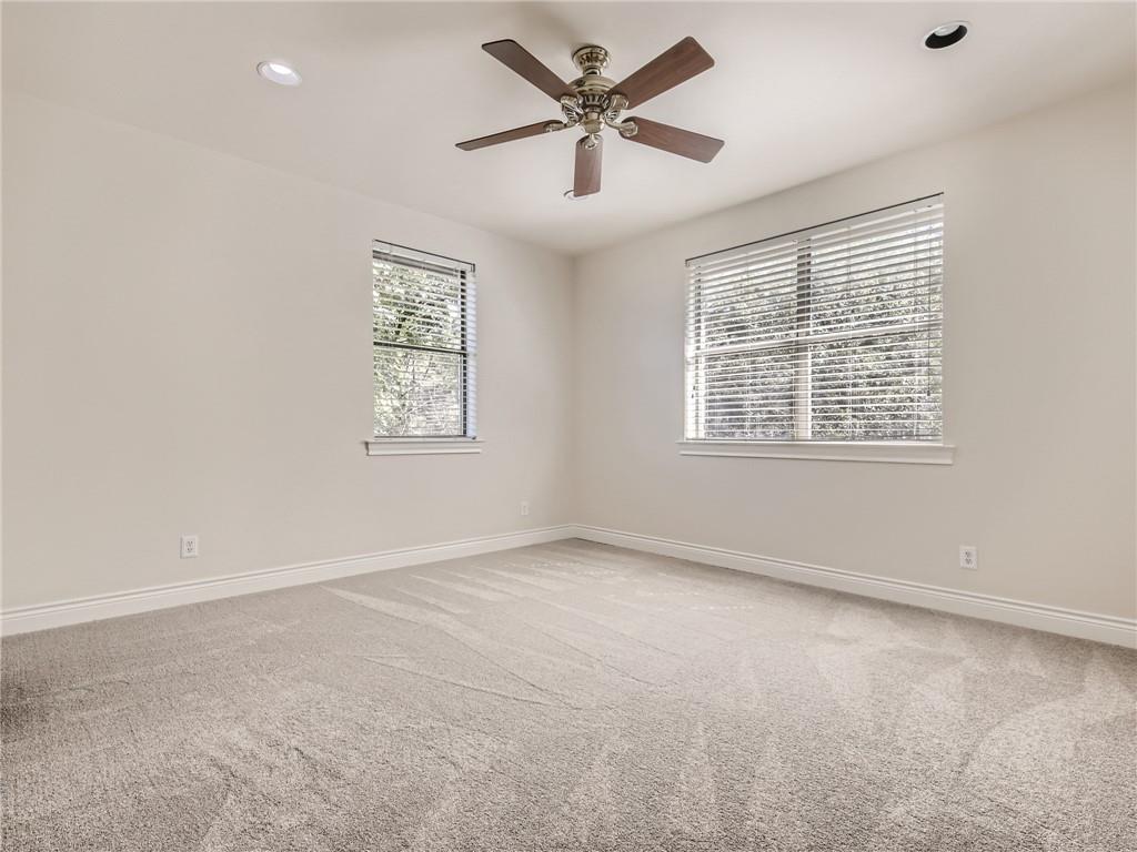 267 North Commons Ford Road Austin, TX 78733 - Photo 22 of 34 Unfurnished room featuring light colored carpet, recessed lighting, and ceiling fan