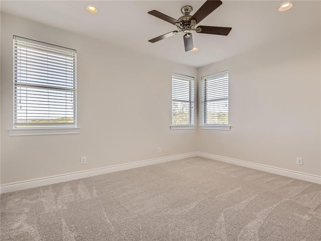 267 North Commons Ford Road Austin, TX 78733 - Photo 25 of 34 Carpeted spare room featuring recessed lighting and ceiling fan
