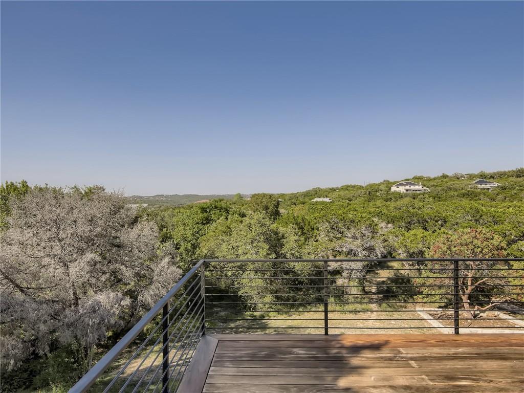 267 North Commons Ford Road Austin, TX 78733 - Photo 30 of 34 Wooden terrace with a wooded view