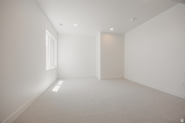 5902 Canyon Rim Road, Unit 620 Lehi, UT 84048 - Photo 67 of 78 Bright room featuring light-colored carpeting, a large window, recessed lighting, and crisp white baseboards