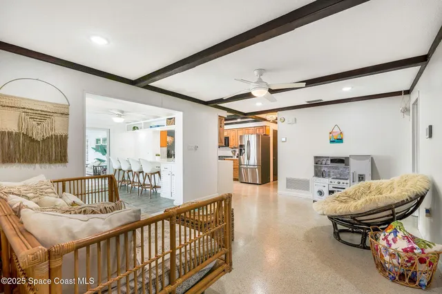 a living room with furniture and a table