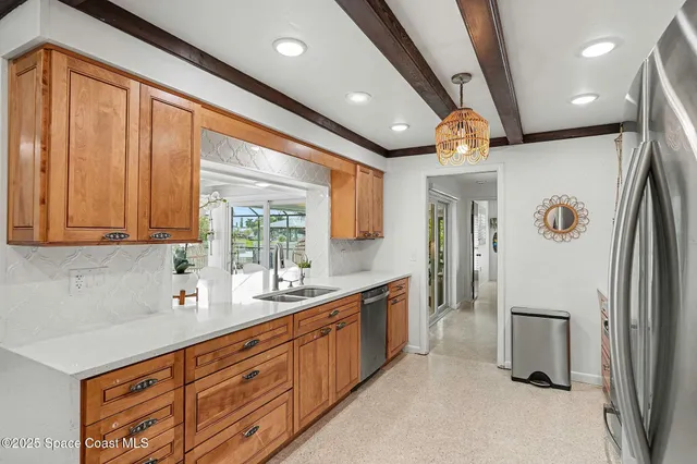 a kitchen with a table and chairs in it
