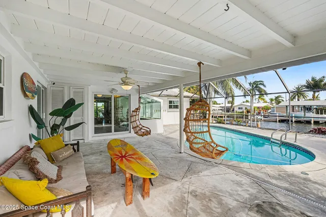 a view of a swimming pool with a patio