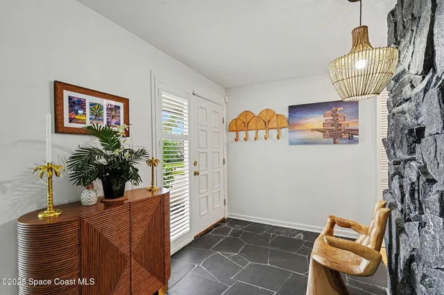 a room with furniture and flower pot