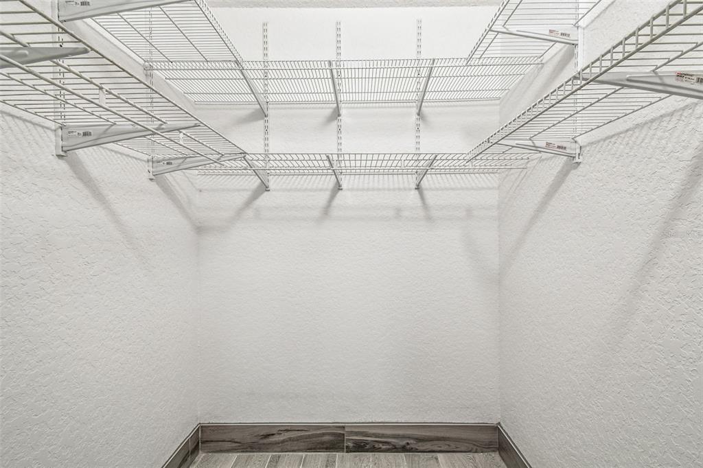 5111 Amulet Drive, Unit 104 New Port Richey, FL 34652 - Photo 36 of 74 a view of a room with racks on the wall