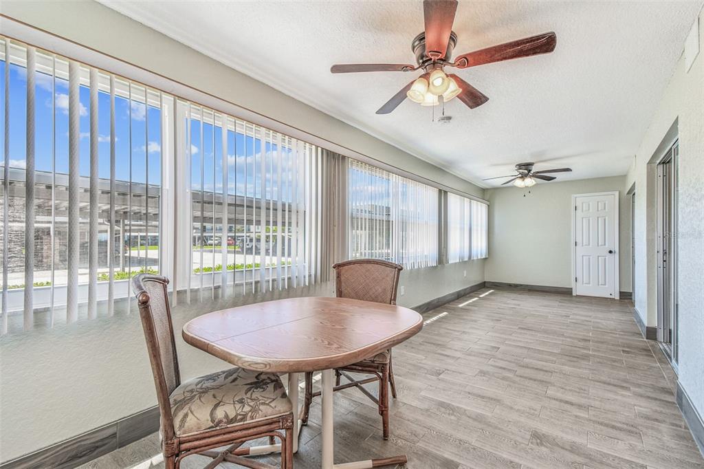 5111 Amulet Drive, Unit 104 New Port Richey, FL 34652 - Photo 43 of 74 a view of a dining room with furniture and window