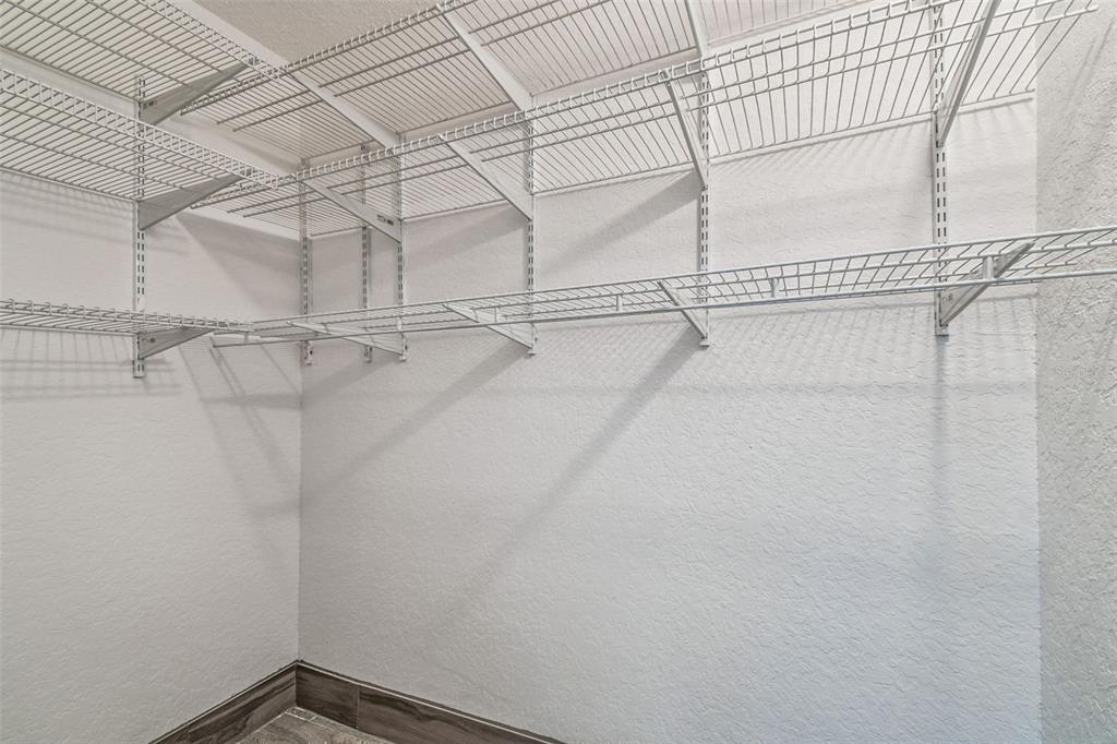 5111 Amulet Drive, Unit 104 New Port Richey, FL 34652 - Photo 45 of 74 a view of a room with racks on the wall