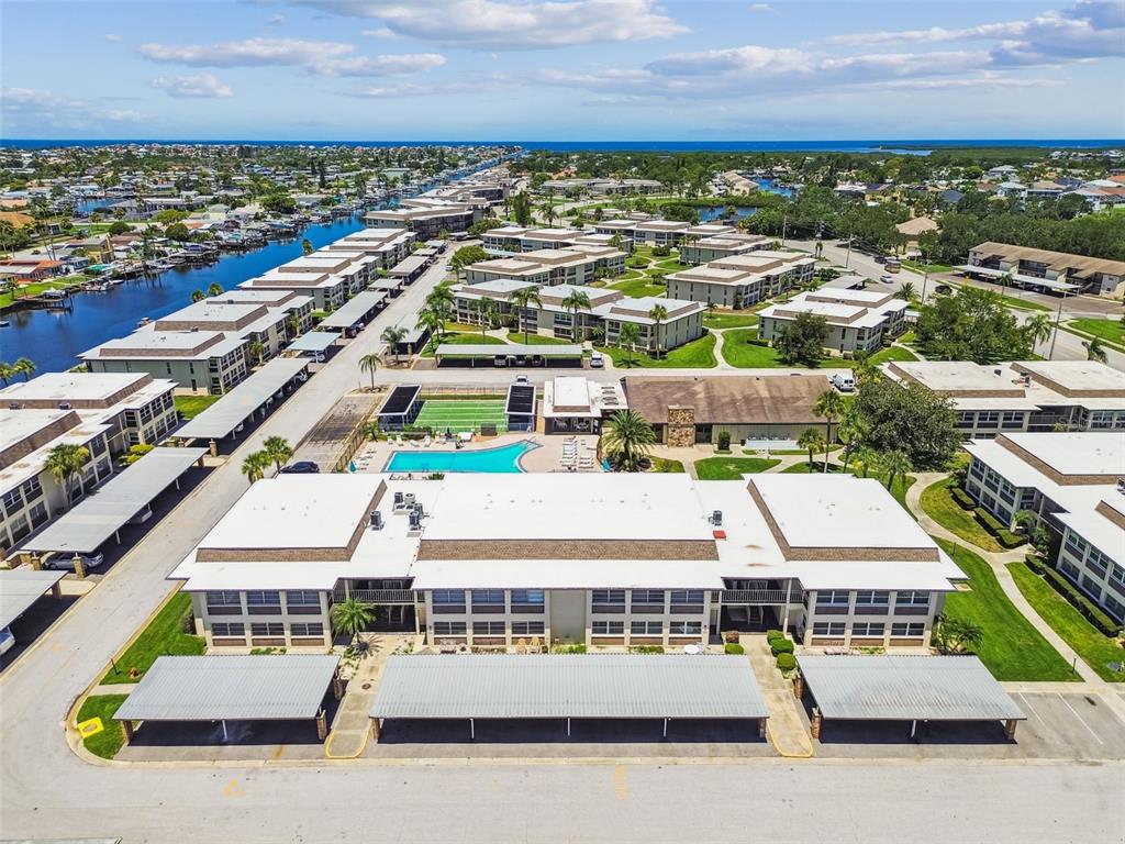 5111 Amulet Drive, Unit 104 New Port Richey, FL 34652 - Photo 52 of 74 a view of a city with lawn chairs