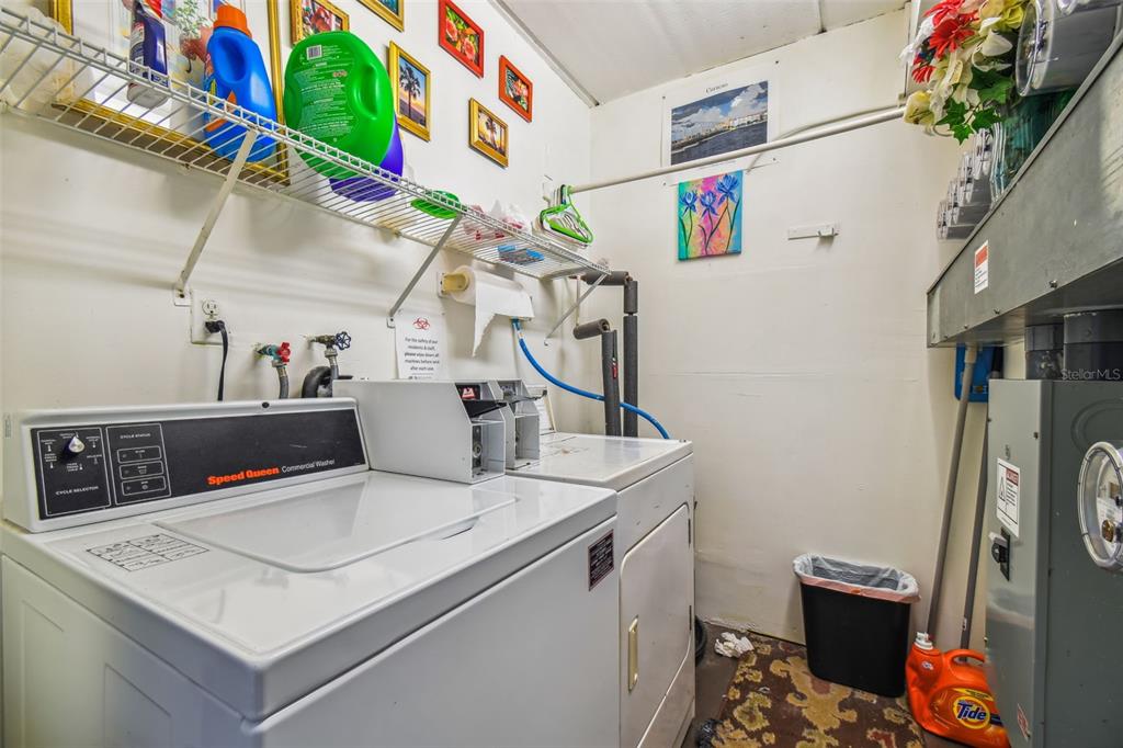 5111 Amulet Drive, Unit 104 New Port Richey, FL 34652 - Photo 62 of 74 a utility room with dryer and washer