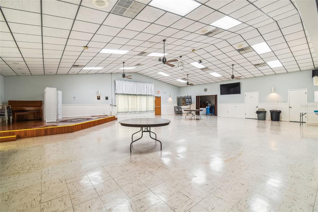 5111 Amulet Drive, Unit 104 New Port Richey, FL 34652 - Photo 66 of 74 a living room with furniture and a table