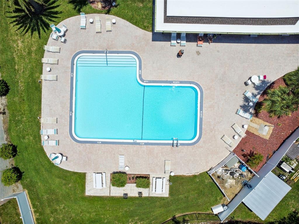 5111 Amulet Drive, Unit 104 New Port Richey, FL 34652 - Photo 69 of 74 an aerial view of a house with garden space and swimming pool