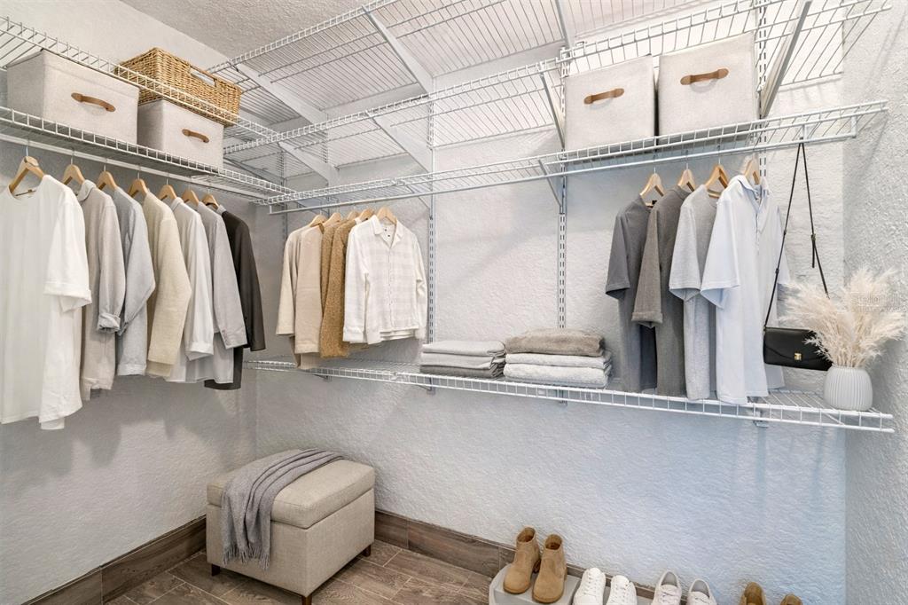 5111 Amulet Drive, Unit 104 New Port Richey, FL 34652 - Photo 7 of 74 a view of walk in closet with clothes and shoes