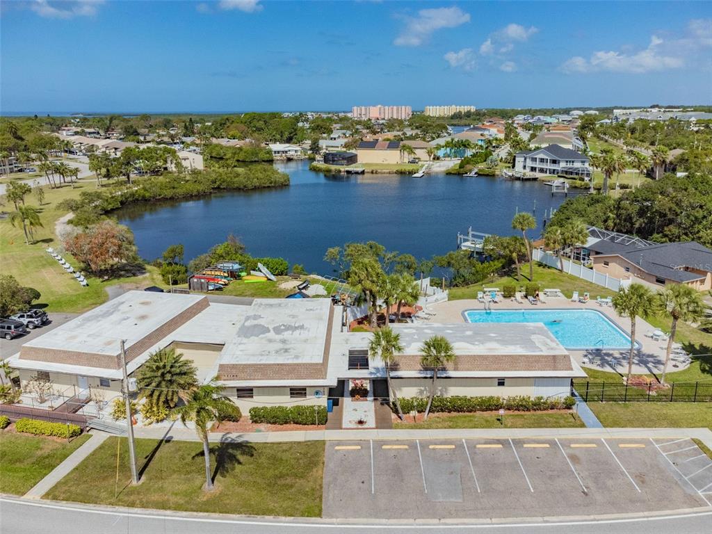 5111 Amulet Drive, Unit 104 New Port Richey, FL 34652 - Photo 72 of 74 an aerial view of residential houses with outdoor space