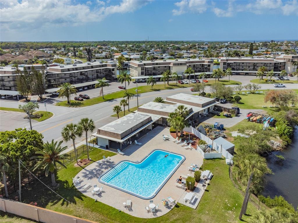 5111 Amulet Drive, Unit 104 New Port Richey, FL 34652 - Photo 73 of 74 an aerial view of a house with a garden