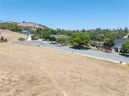 a view of a street with a building in the background