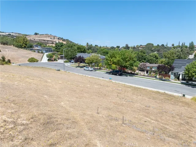 a view of a street with a building in the background