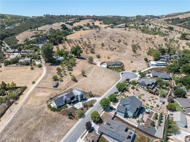an aerial view of house with a yard