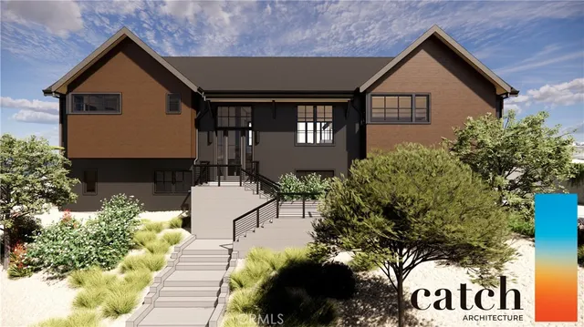 a front view of a house with a yard and potted plants