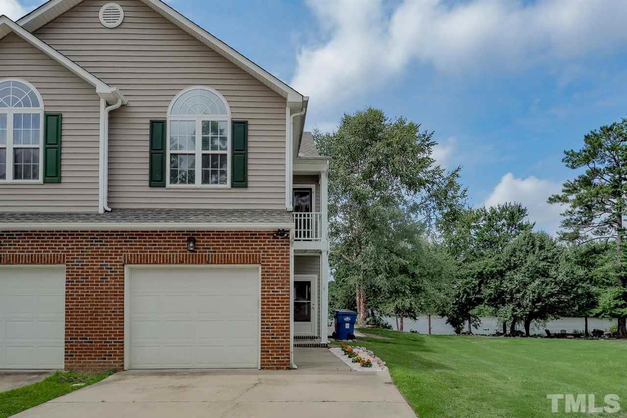 2341 Persimmon Ridge Drive Raleigh, NC 27604 - Photo 1 of 25 a front view of a house with a yard