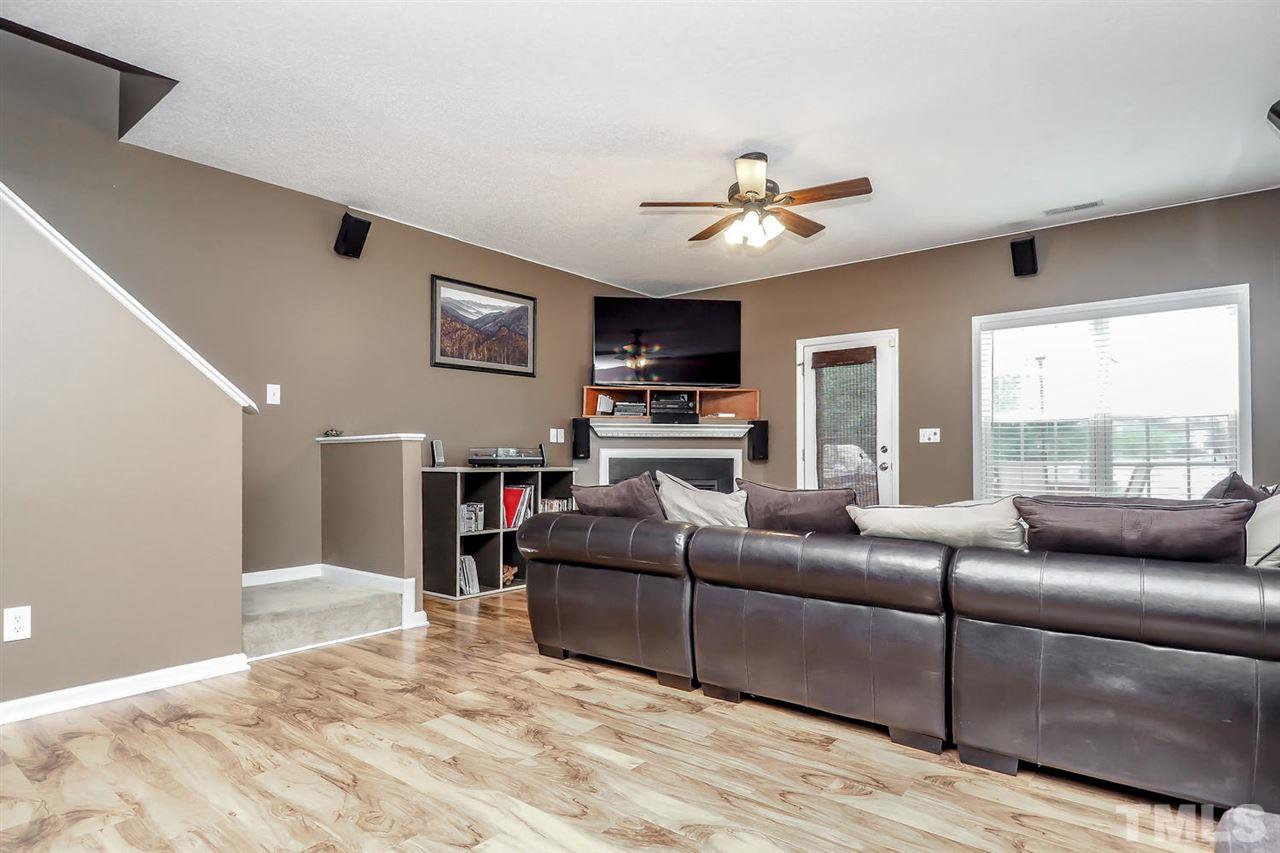 2341 Persimmon Ridge Drive Raleigh, NC 27604 - Photo 13 of 25 a living room with furniture and a flat screen tv