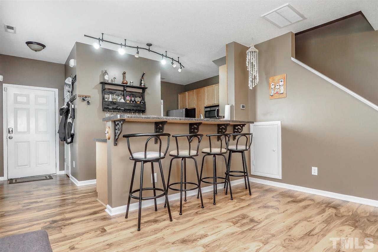 2341 Persimmon Ridge Drive Raleigh, NC 27604 - Photo 18 of 25 a view of a kitchen with cabinets and wooden floor