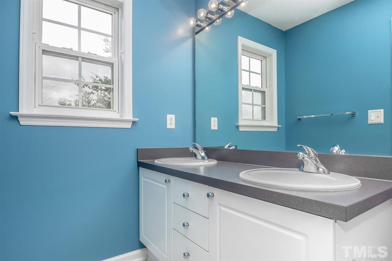 2341 Persimmon Ridge Drive Raleigh, NC 27604 - Photo 20 of 25 a bathroom with a sink and a mirror